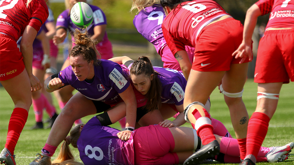 close up of women's rugby players on the pitch