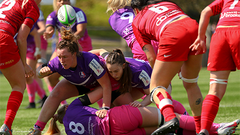 close up of women's rugby players on the pitch