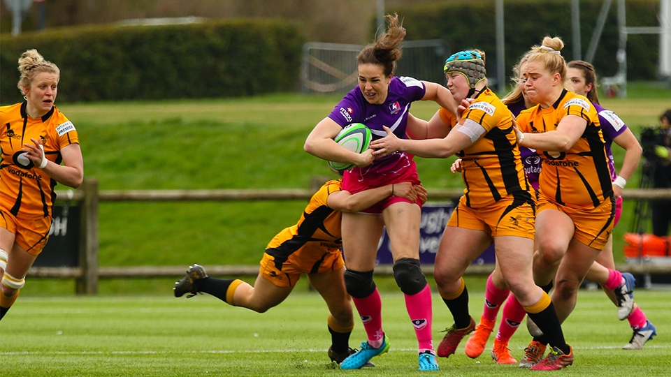 close up of women's rugby players on the pitch