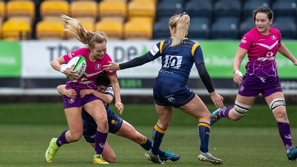 close up of women's rugby players on the pitch