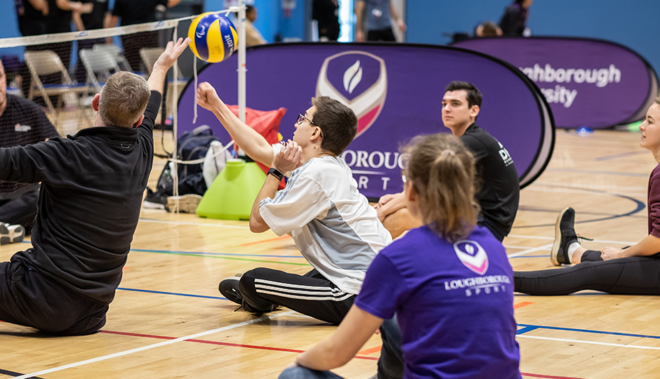 people playing sitting volleyball