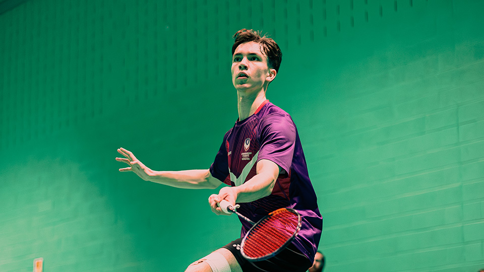 male badminton played about to return a shot