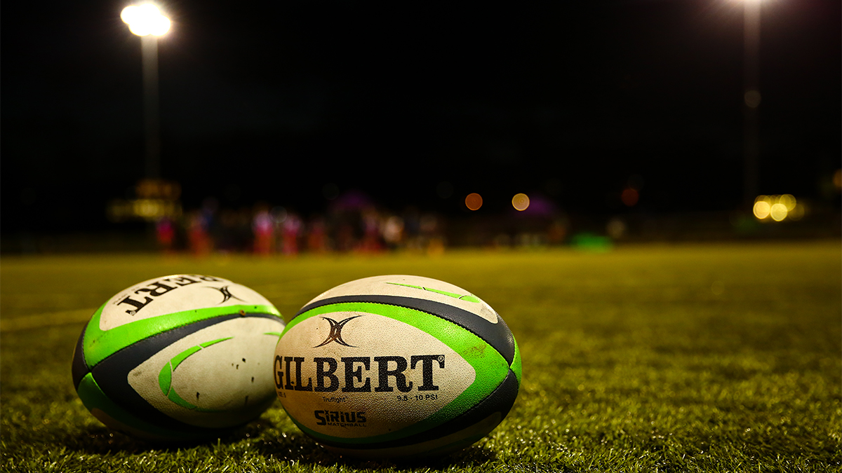 two rugby balls on the pitch