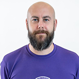 Andy Wallace wearing Loughborough Swimming kit, smiling, looking directly at the camera