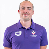 Connor Andrews wearing Loughborough Swimming kit, smiling, looking directly at the camera