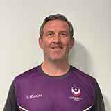 Richard Denigan wearing Loughborough Swimming kit, smiling, looking directly at the camera