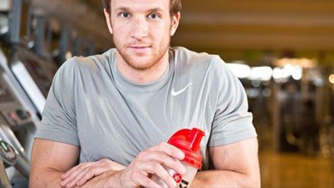 a man holding a sports drink
