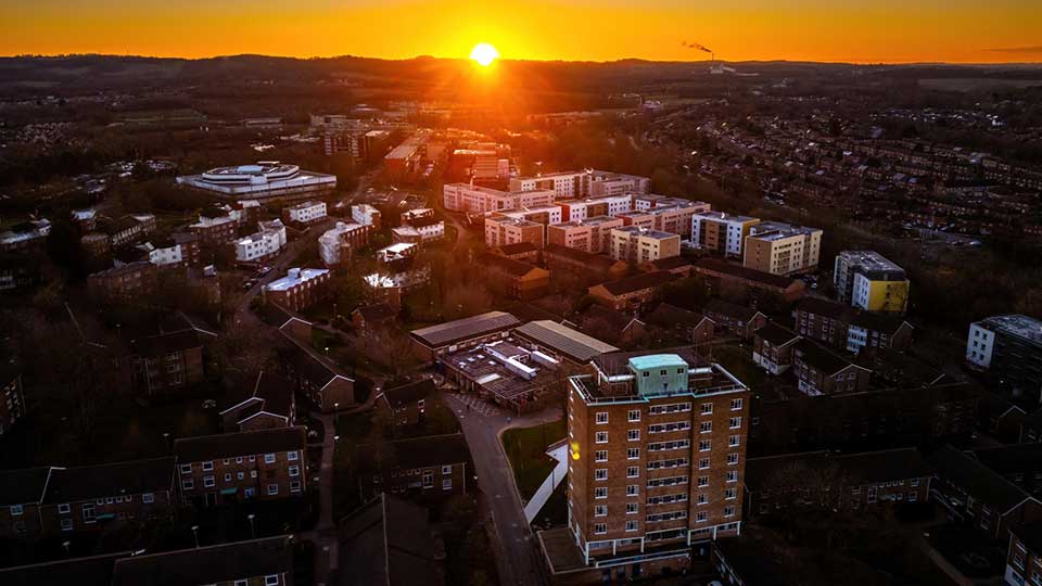 Aerial view of sunset over campus.