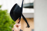 Close-up view of a black graduation cap, or mortar-board, prior to being launched in the air (hot tip - please don't do this, it upsets Ede and Ravenscroft!).