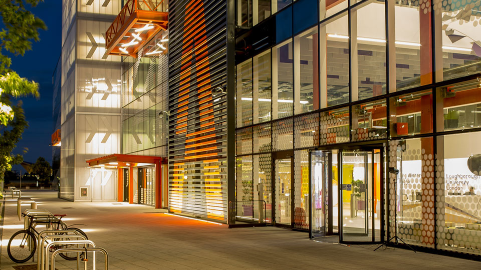 a bicycle outside the London building at night
