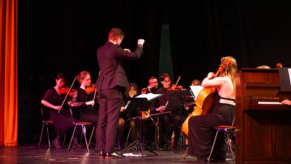 An orchestra on stage.