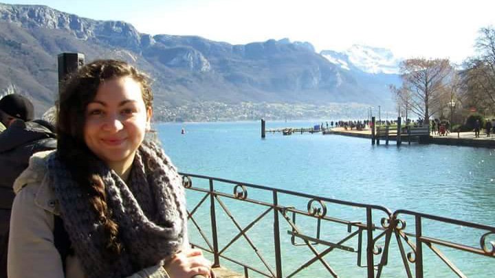 Merve Gunenc standing by a lake in France