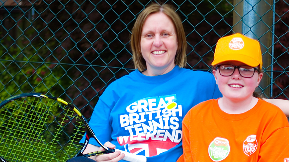 Mother with young tennis player