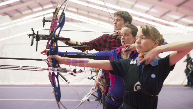 Students practicing archery