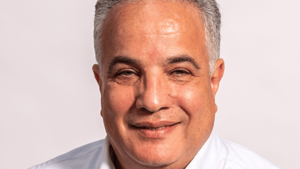 Portrait photo of an academic, Mohamed Osmani, on a white background