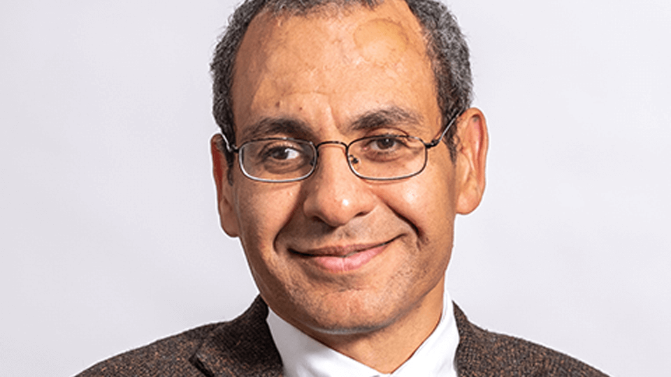 Portrait photo of an academic, Peter Demian, on a white background