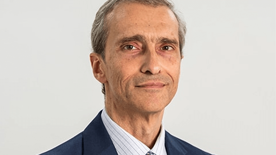 Portrait photo of an academic, Tarek Hassan, on a white background