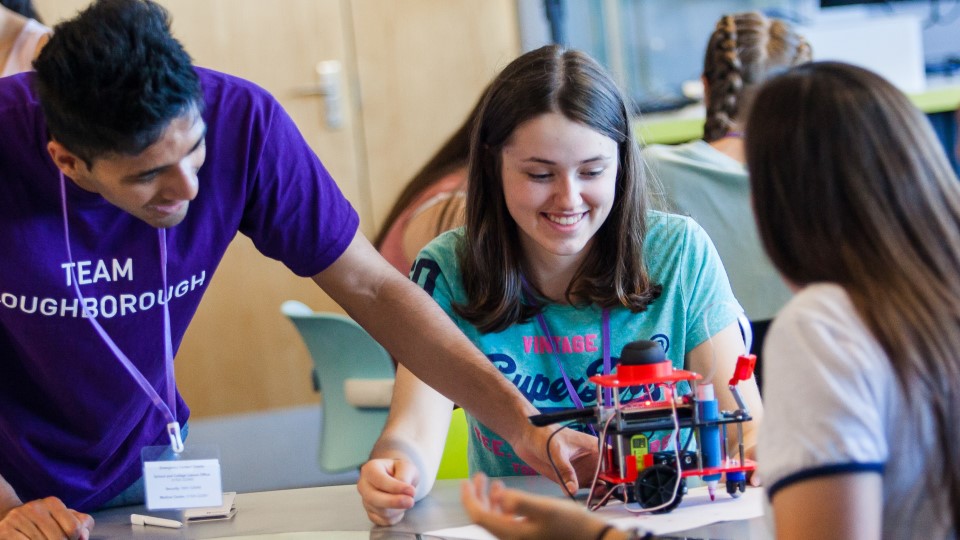 Loughborough ambassador helping students with a build.