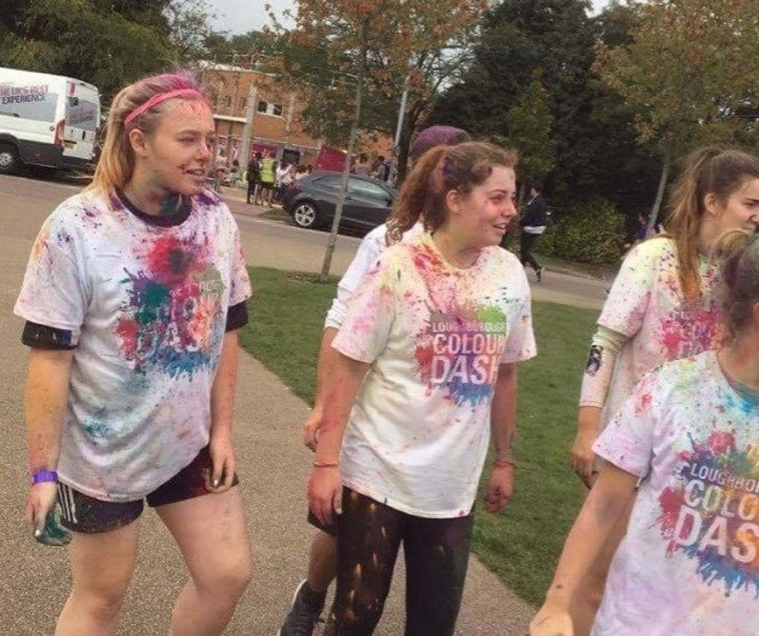 Becki and her friends after the Loughborough University colour dash. Becki's top is covered in multi-coloured paint that was thrown at her during the dash.  