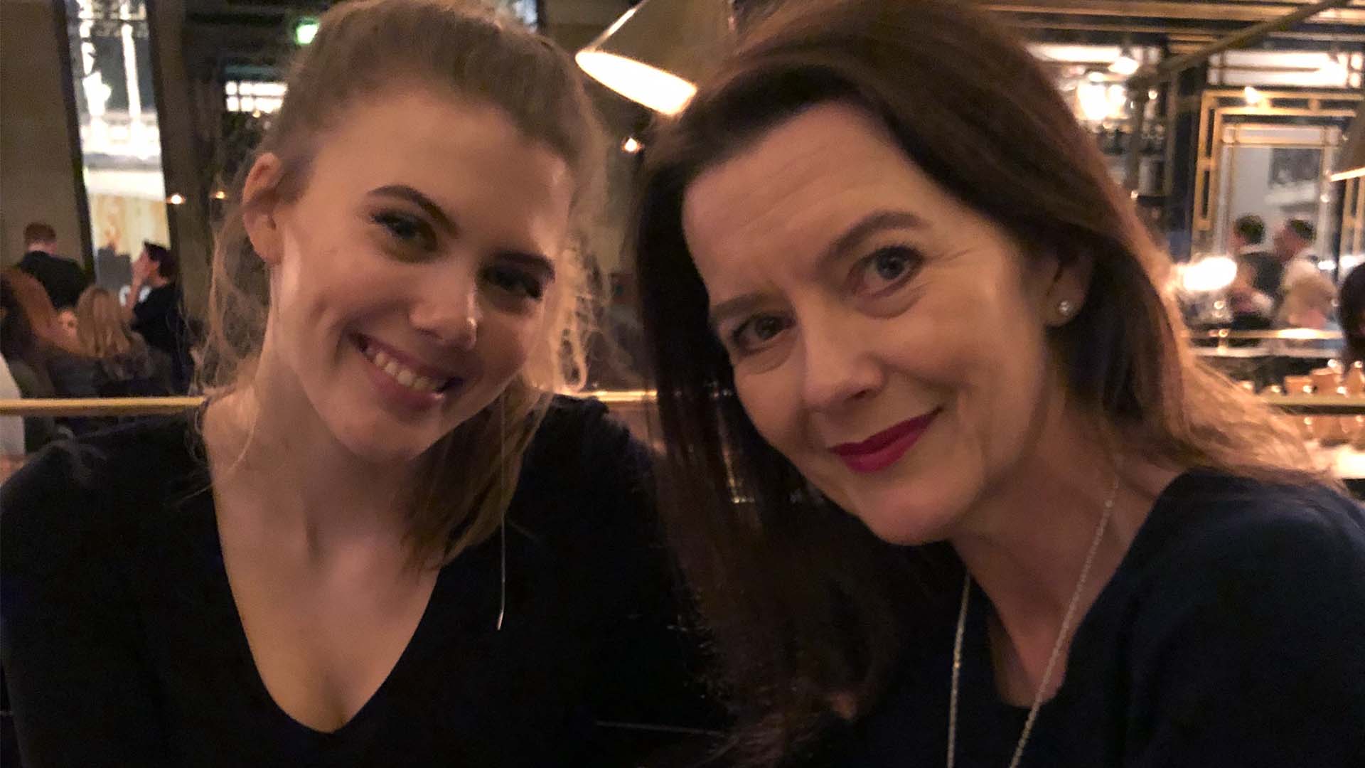 Caroline and her mother at a restaurant. 
