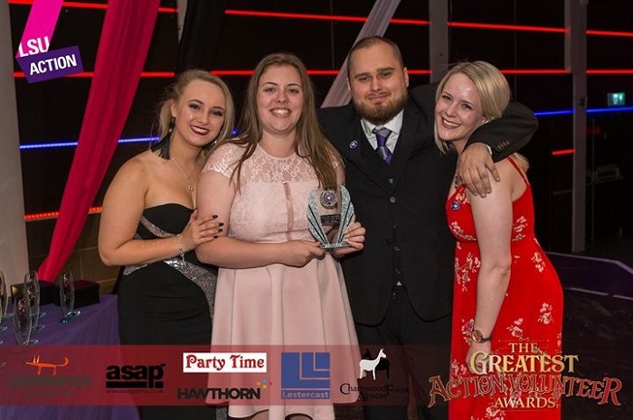 Leah collecting an LSU Action award on stage at the students union during the greatest action awards night. 