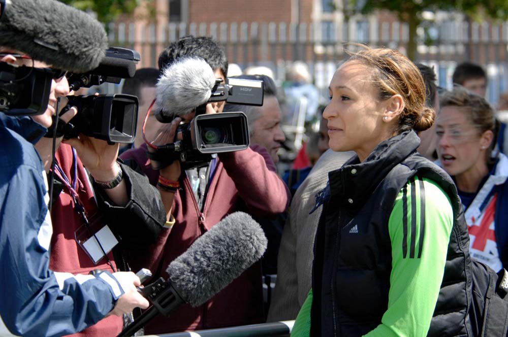 Jessica Ennis-Hill in front of cameras and journalists giving an interview. 