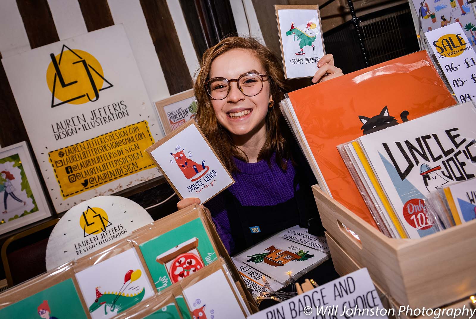 Lauren with her designs and prints that she has illustrated and produced. 