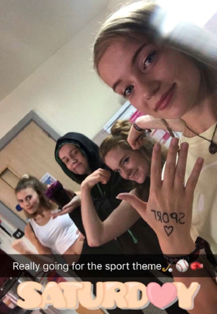 Caroline and three friends dressed up in sports wear for a sports themed social with the caption on the photo being 'Really going for the sports theme' with a hockey stick, baseball, and boxing glove emojis. 