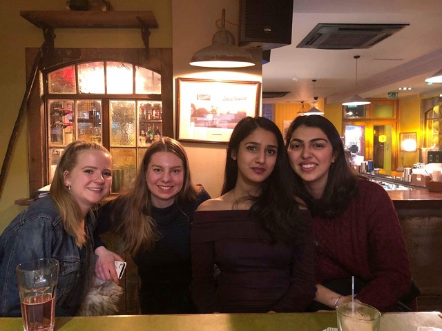 Simona and three friends at a restaurant.  