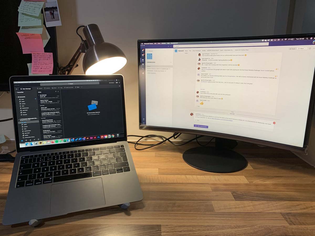 Lilymae's working station with her laptop and a computer screen next to each other on a desk. 