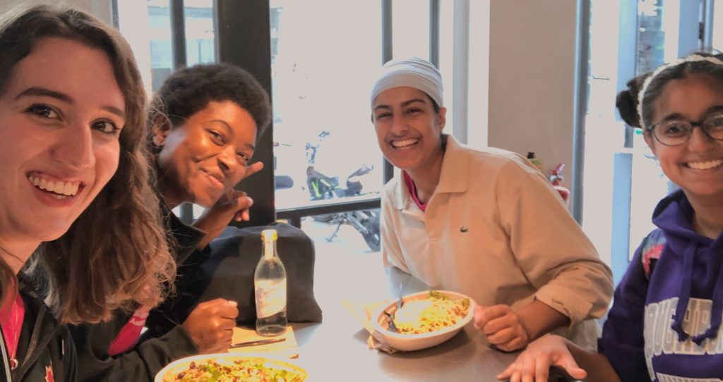 Gugundeep and three friends at a restaurant. 