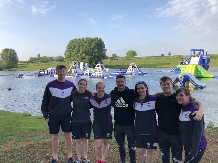 Hannah and some of her friends in front of an inflatable water course. 