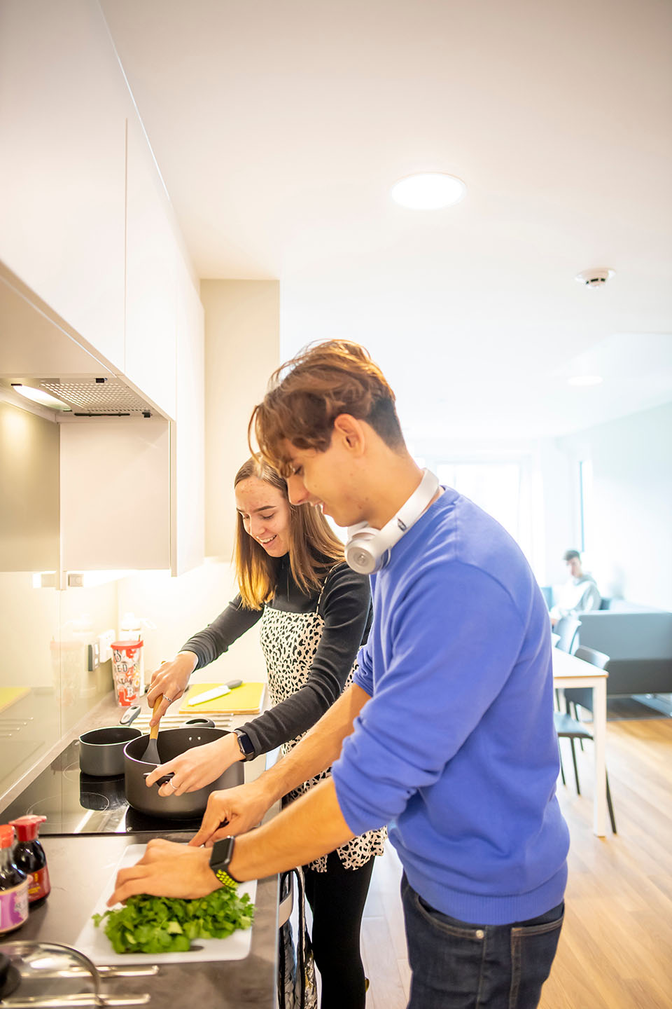 Nathan cooking with a friend