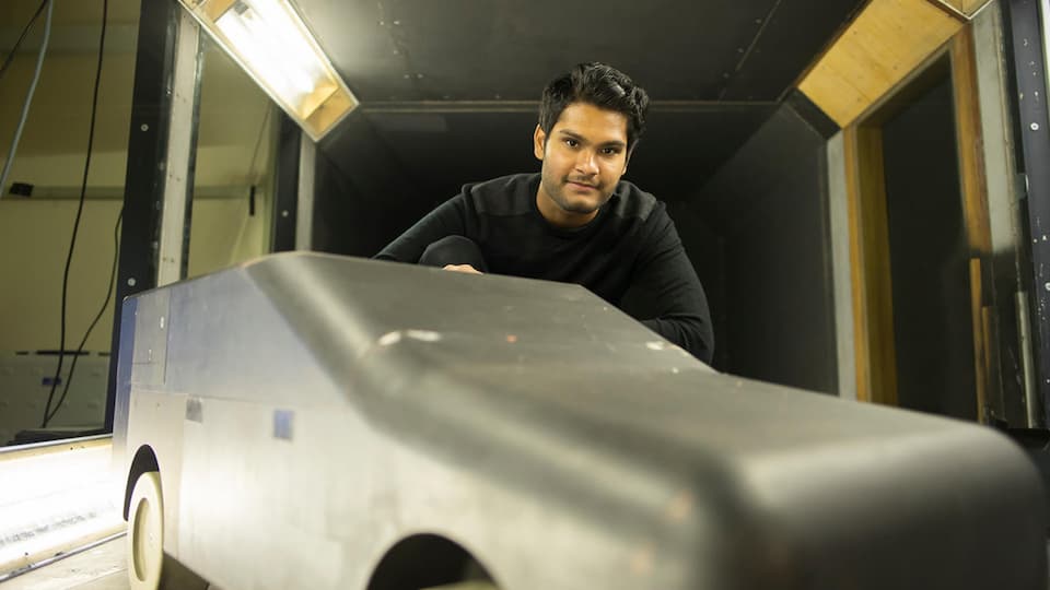 A student using the wind tunnel facility