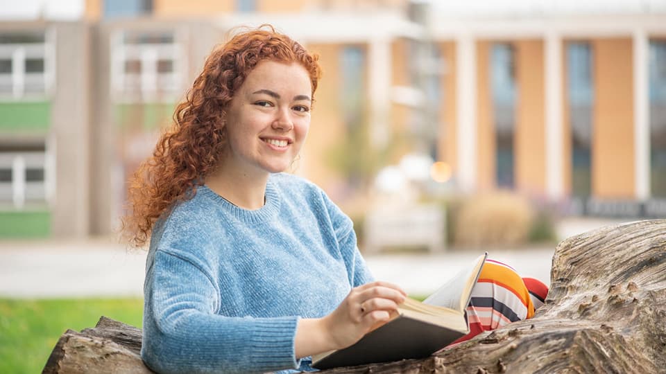 Amie studying outside.