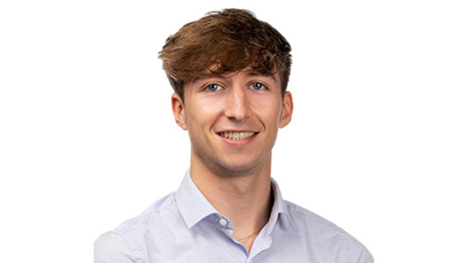 A student smiling to camera