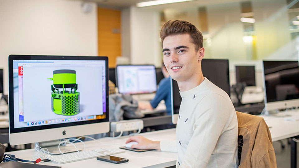 A student working at a computer in the Design School at Loughborough University