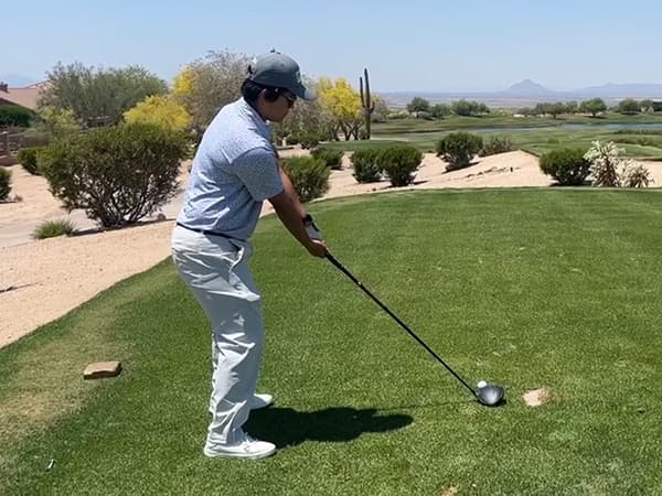 Laurel playing golf.