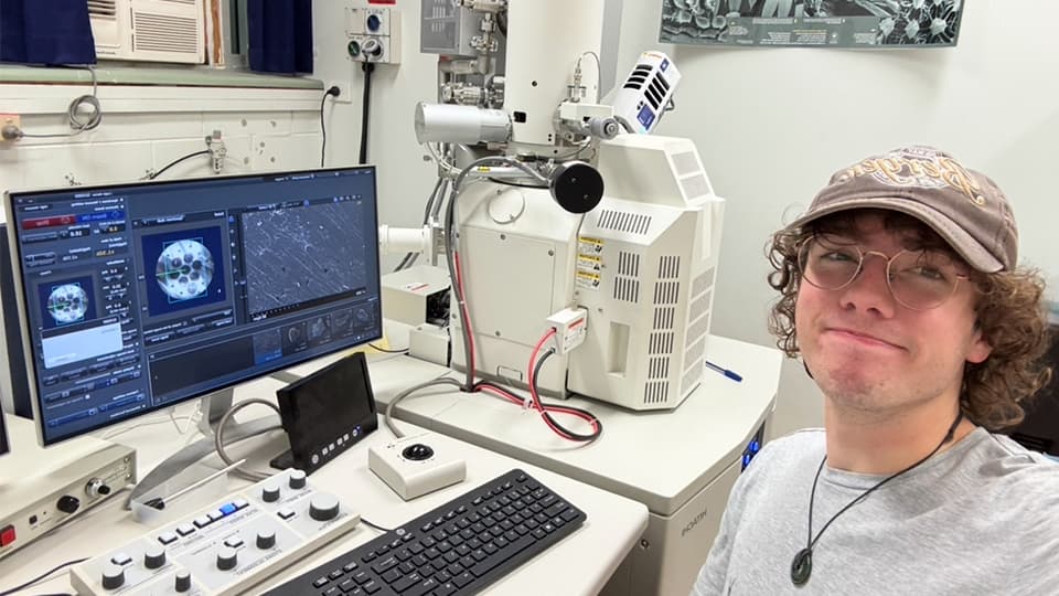 Dominic sat in a Chemical Engineering lab next to a computer