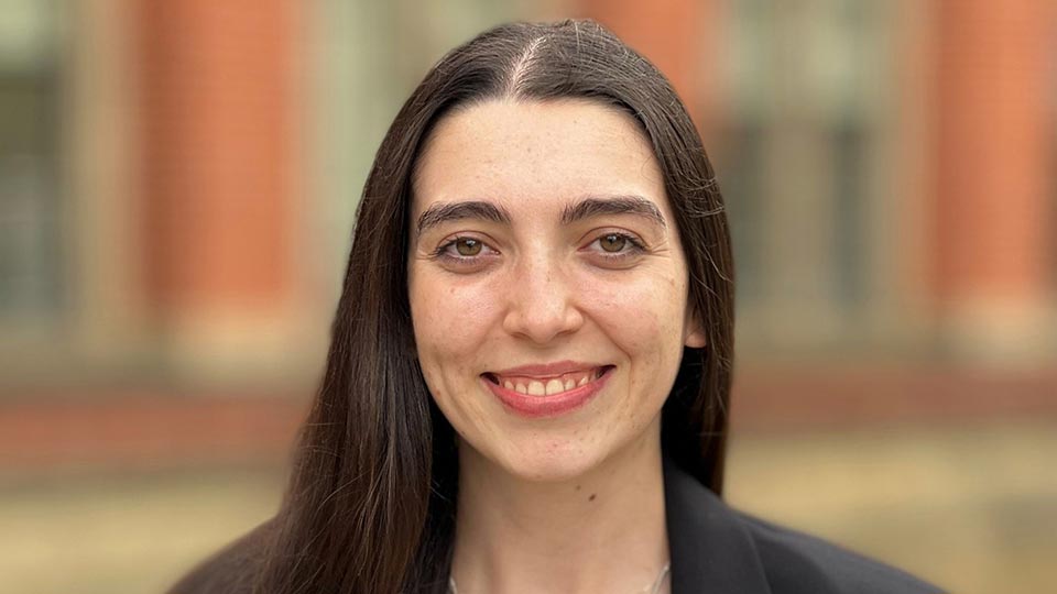 A student smiling to camera