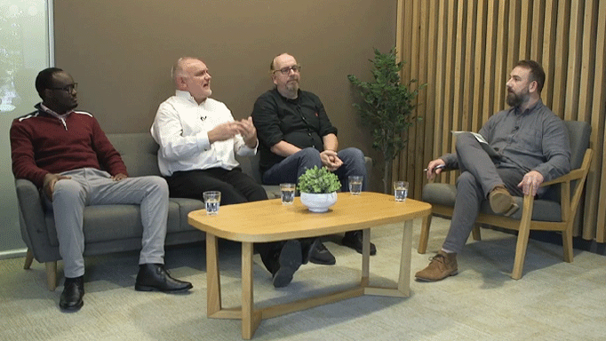 4 men seated having a discussion