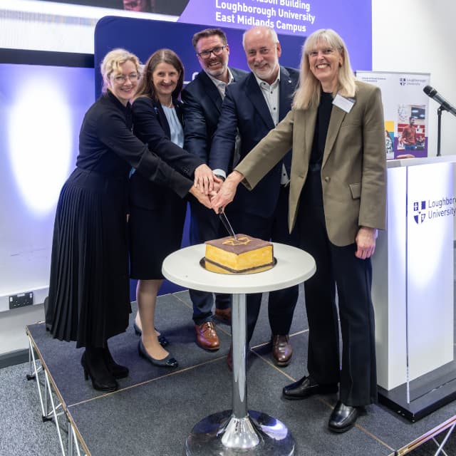 A celebratory cake being cut