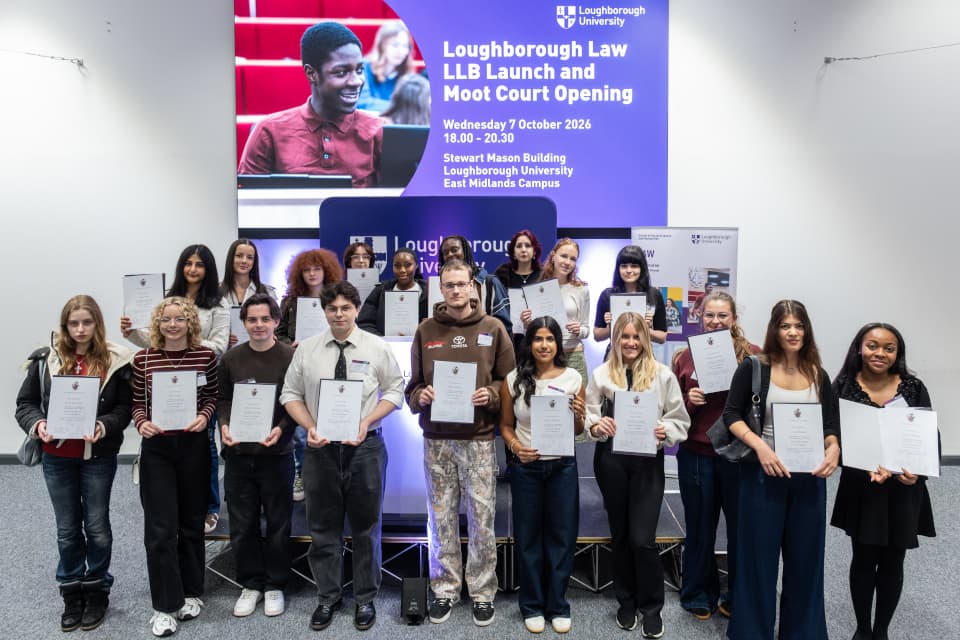 a group of students holding up certificates