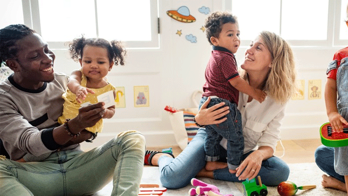 two parents with toddler children