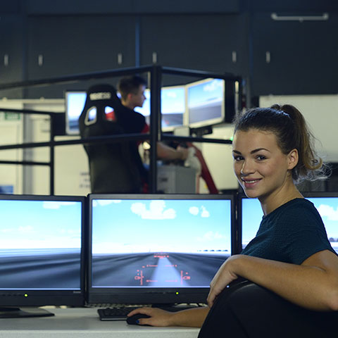 Students using flight simulator