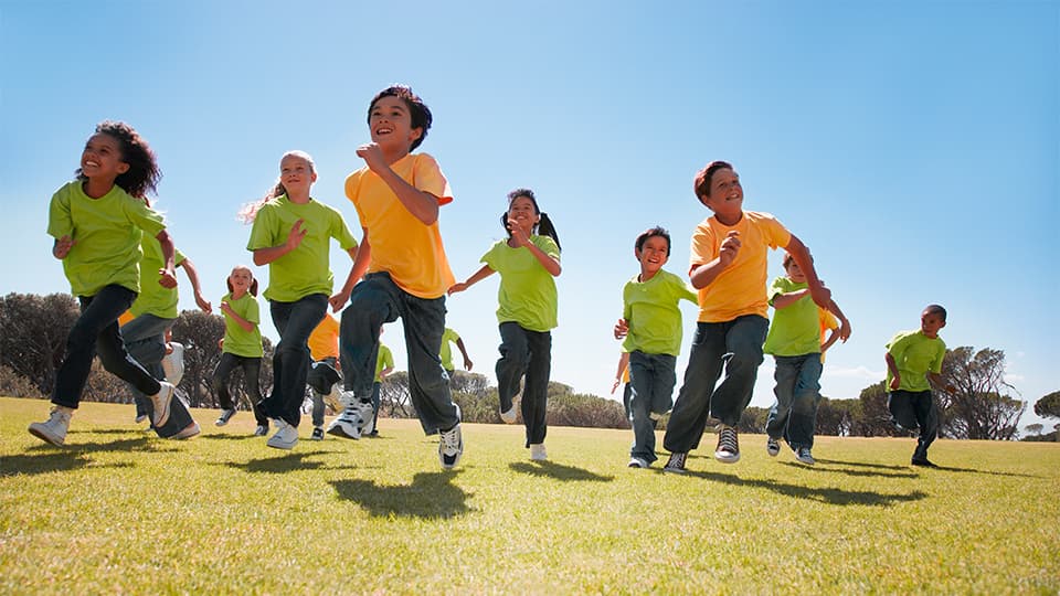 Children running in a school field