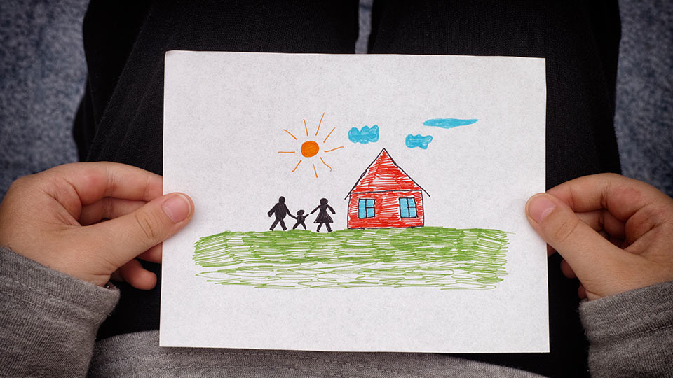 Pictured is a child's drawing of a classroom. 