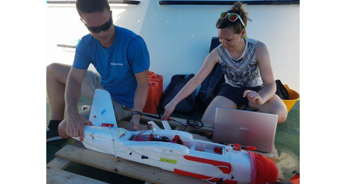 Melissa Schiele working with drone alongside Dr Tom Letessier

