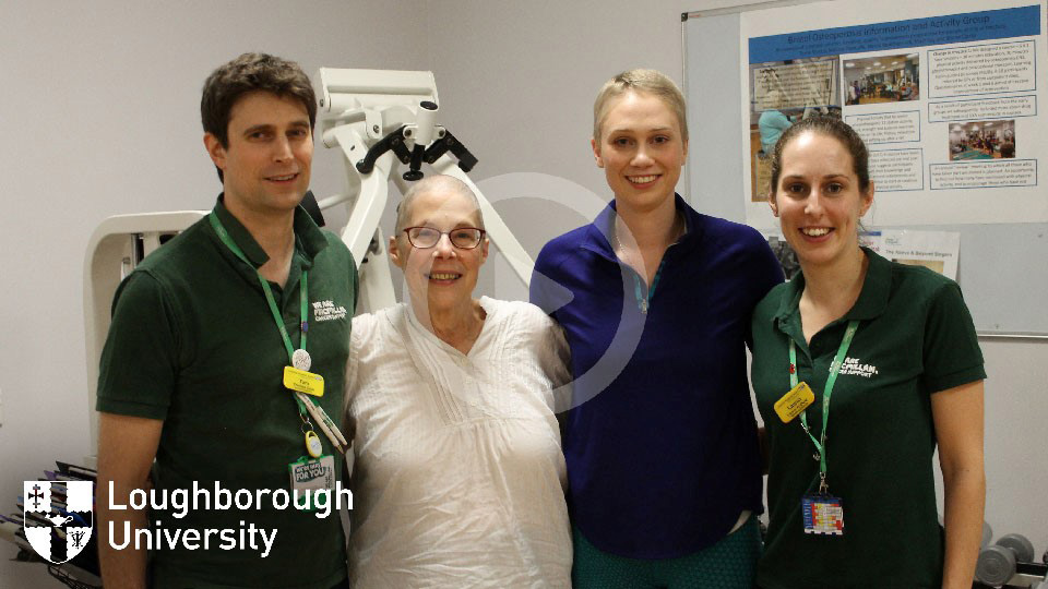 Photo of JJ, her mum and staff at the hospital where she received treatment