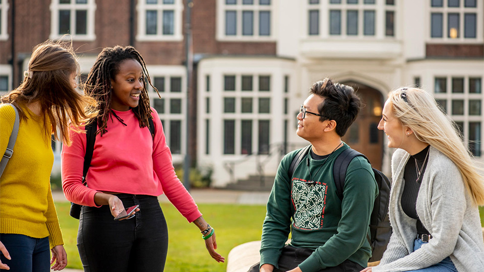 Photo of students chatting around the Hazlerigg/Rutland fountain 